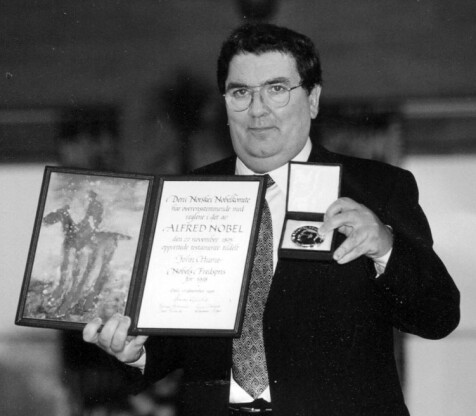 John Hume displays Nobel Peace Prize medal and certificate